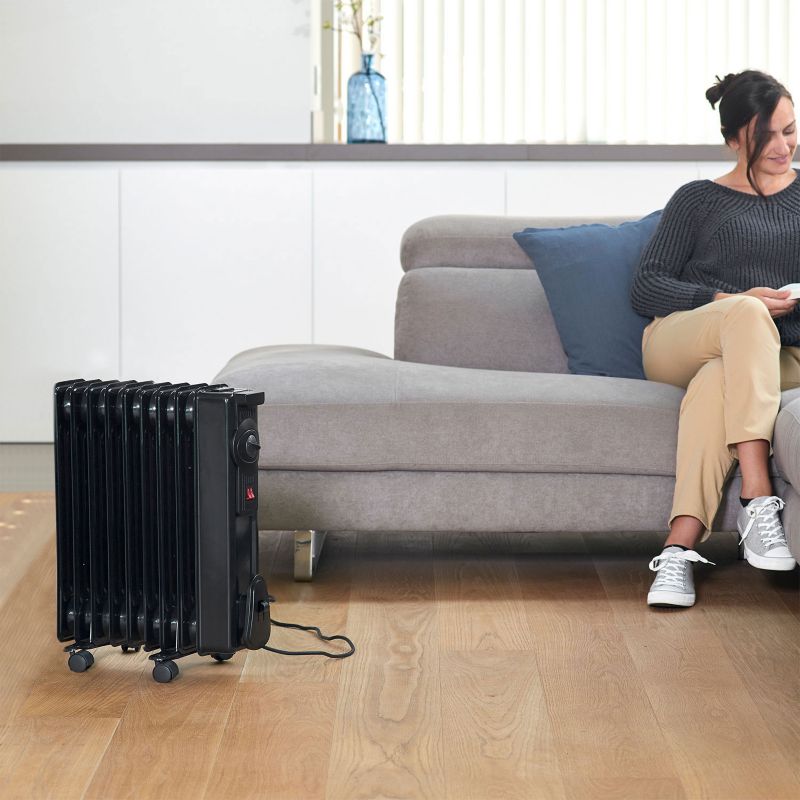 Grzejnik olejowy Black+Decker 1500W BXRA, czarny, termostat, światełko, kółka, 1 szt.
