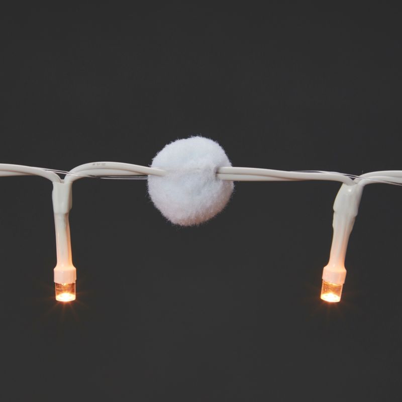 Lampki wewnętrzne 50 LED pompony barwa ciepła biała